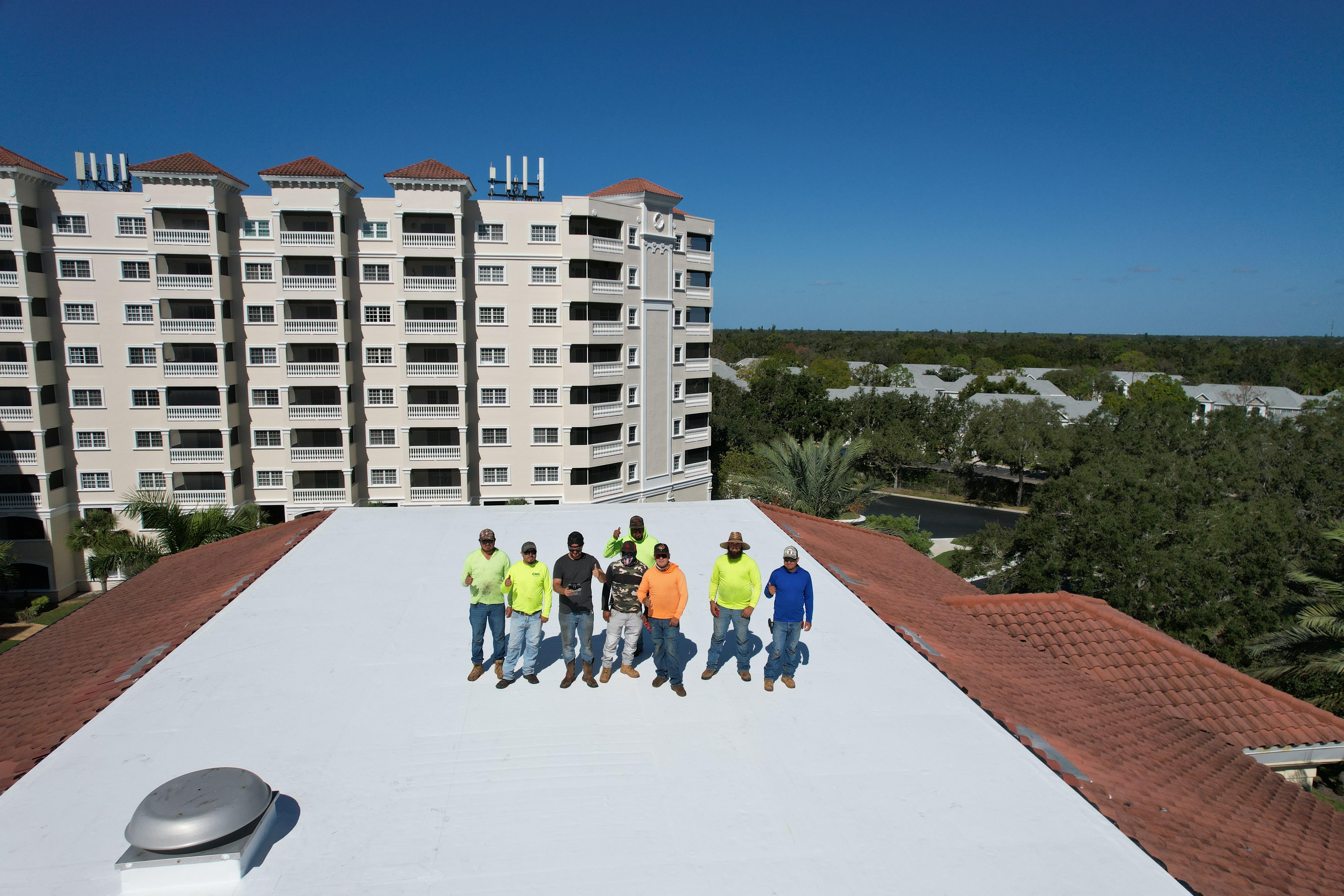 Ocean Group Construction crew on completed commercial roof